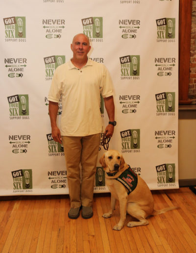 Veteran received yellow lab service dog at Got Your Six Support Dogs graduation ceremony
